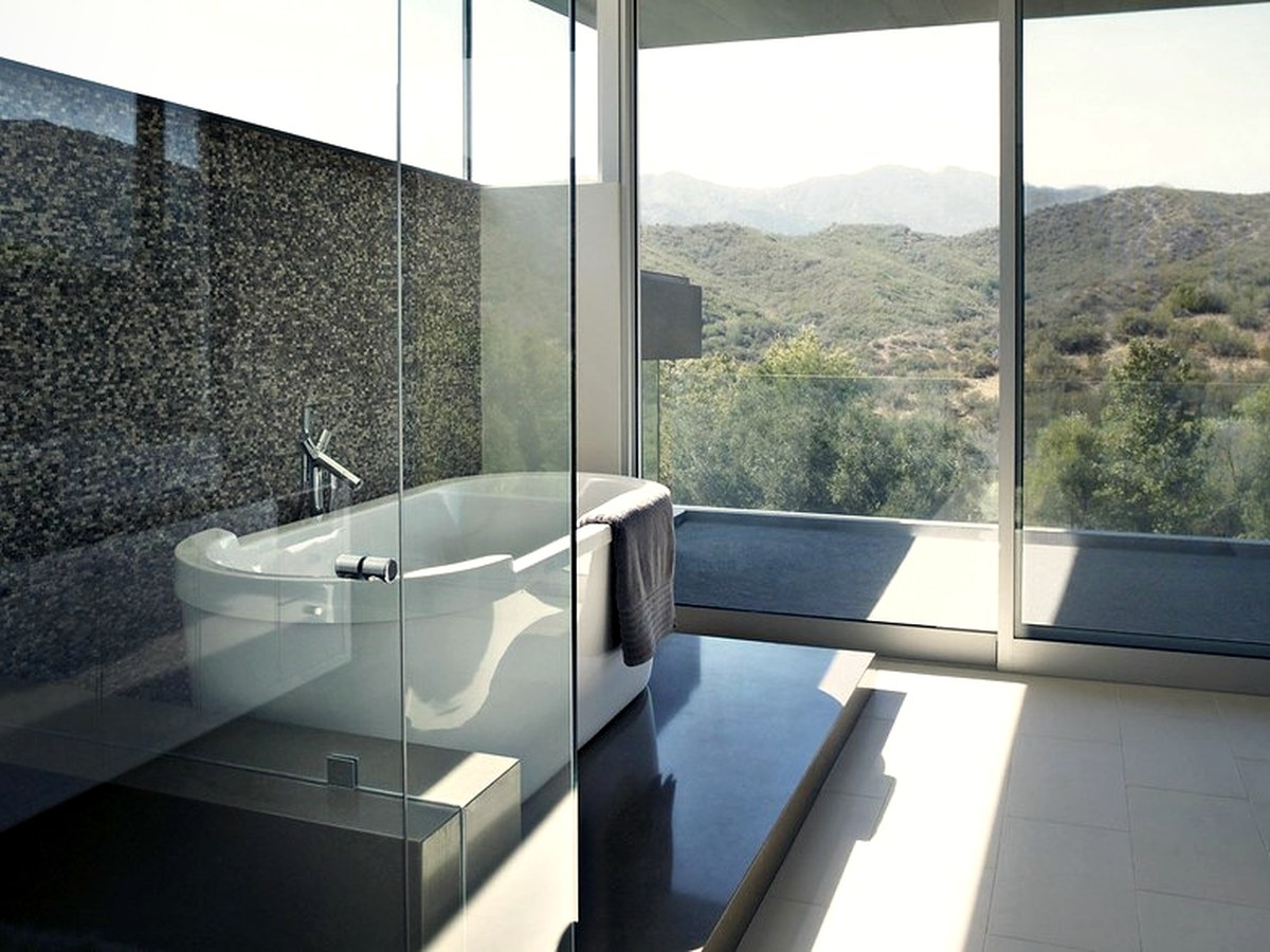 Renovation & Refurbishment Across Europe A finished bathroom with tiling, shower enclosure and fitted sanitaryware